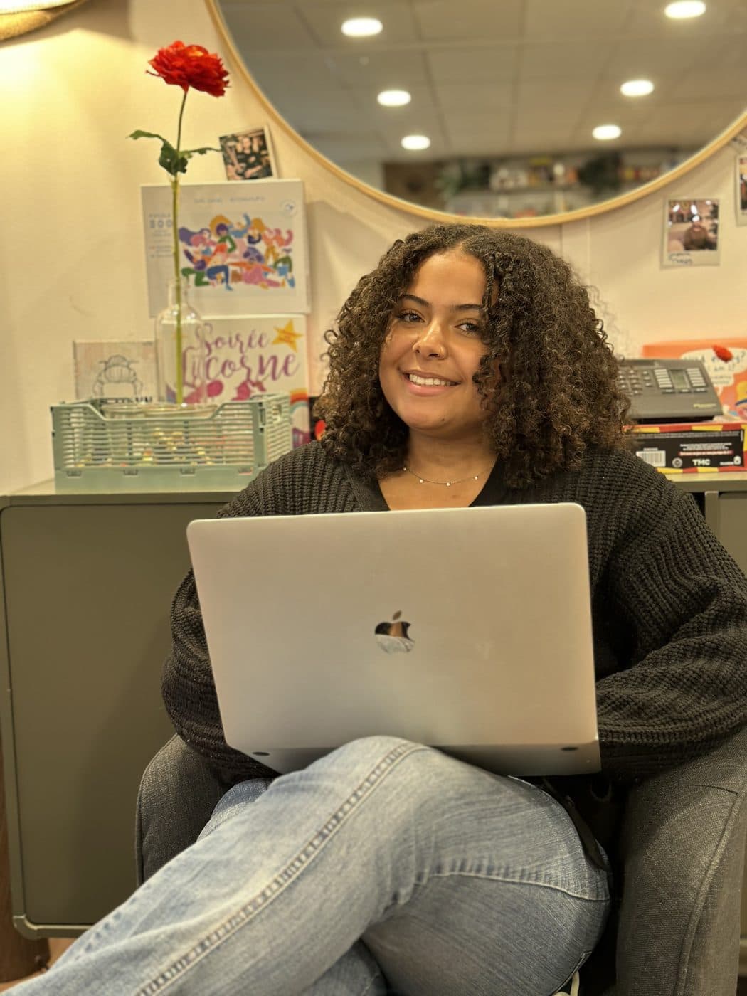 One of our English Sisters smiling with her laptop